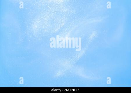 delicato sfondo blu con sequine onde movimento liquido Foto Stock