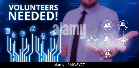 Cartello che mostra volontari necessari. Business Concept sociale Comunità di carità Volontariato Foto Stock