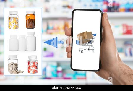 Uomo con smartphone che ordina farmaci online, primo piano Foto Stock