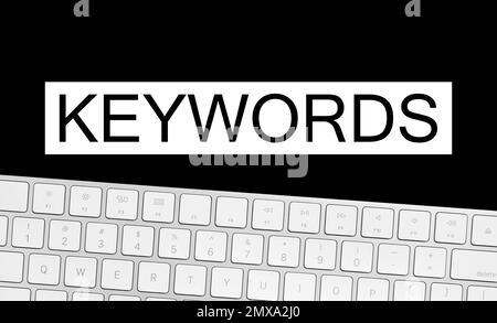 Parole chiave e tastiera del computer su sfondo nero. Direzione SEO Foto Stock