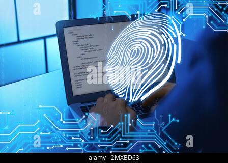 Fingerprint identification. Man working with laptop at table, closeup Foto Stock