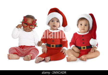 Collage con foto di graziosi bambini su sfondo bianco. Primo Natale Foto Stock