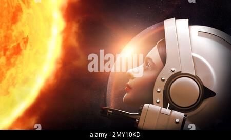 Astronauta donna contro il pianeta Sole nello spazio esterno. Elementi di questa immagine forniti dalla NASA. Foto Stock