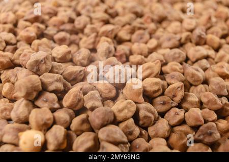 ceci sfondo marrone. nutrizione. ingrediente alimentare. profondità di campo ridotta.foto macro. Foto Stock