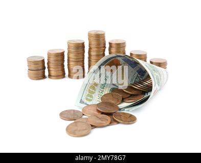 Dollari e monete isolate su bianco Foto Stock