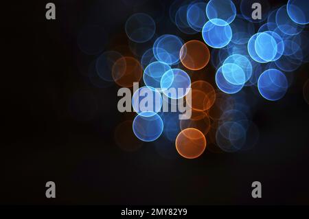 Il bokeh si illumina su sfondo nero Foto Stock