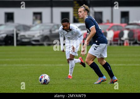 Swansea, Wales. 4 February 2023. Aimar Govea of Swansea City under pressure  from Finley Cotton of Millwall during the Professional Development League  game between Swansea City Under 18 and Millwall Under 18