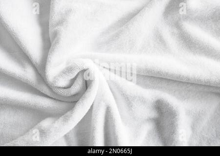 Foto di sfondo in tessuto bianco naturale di cotone con messa a fuoco selettiva. Foto Stock