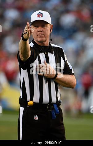 Oakland Raiders quarterback Derek Carr (4) has works with referee Carl  Cheffers (51) and umpire Bill Schuster (129) during the second half of an  NFL football game against the Kansas City Chiefs