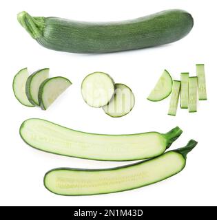 Set di zucchine fresche mature su sfondo bianco Foto Stock