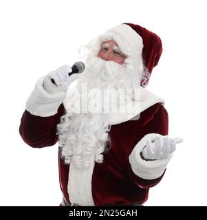 Babbo Natale cantando con microfono su sfondo bianco. Musica di Natale Foto Stock