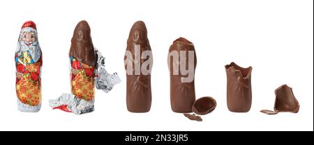 Gustoso cioccolato Babbo Natale caramella su sfondo bianco, mangiare passi. Design del banner Foto Stock