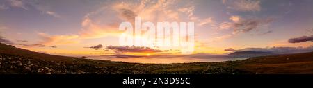 Aerial view of sunset over Kihei Town and the Pacific Ocean; Maui, Hawaii, United States of America Stock Photo