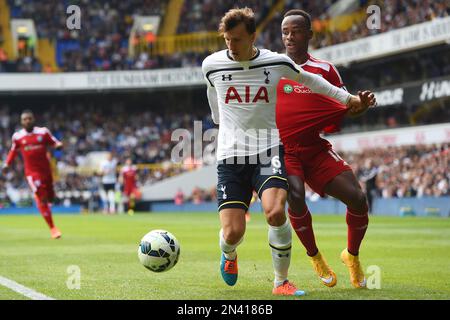 CAPTION CORRECTS LOCATION - Tottenham Hotspur’s Vlad Chiriches, left, competes for the ball with West Bromwich Albion’s Saido Berahino during their English Premier League soccer match at White Hart Lane, London, Sunday, Sept. 21, 2014. (AP Photo/Tim Ireland)