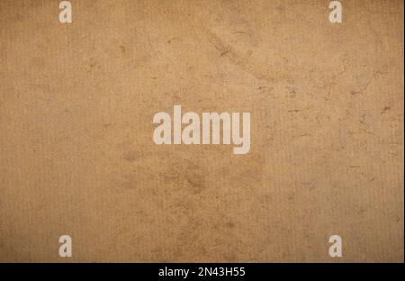 Texture di vecchio cartone marrone bagnato primo piano. Foto Stock
