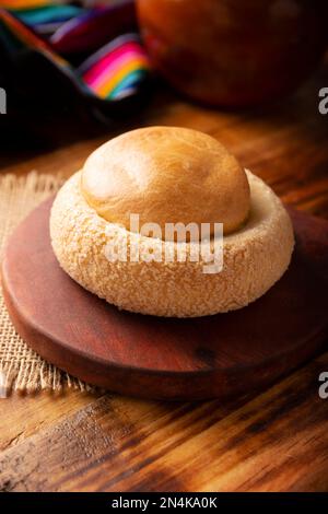 Ojo de Pancha. Conosciuto anche come Ojo de Buey, è uno dei tradizionali pani dolci messicani, che consiste in un anello di pane fioccato riempito con un Foto Stock