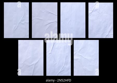 Varietà di bianco grinzito e corrugato adesivo carta incollata poster texture isolato su sfondo nero. Foto Stock