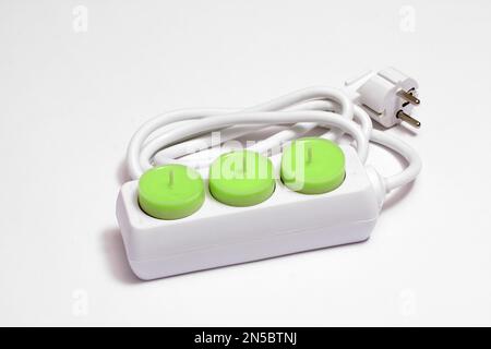 presa di corrente con candele verdi per il tè, per risparmiare energia Foto Stock