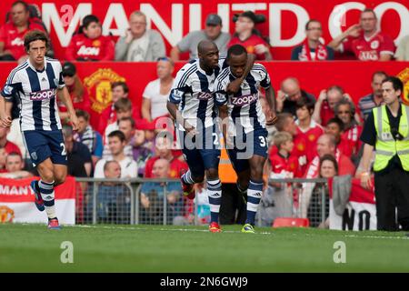 West Bromwich Albion's Saido Berahino, right, celebrates with teammates after scoring against Manchester United during their English Premier League soccer match at Old Trafford Stadium, Manchester, England, Saturday Sept. 28, 2013. (AP Photo/Jon Super)