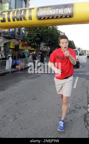 Celebrity host Billy Bush race across the starting line in the Men's Health Urbanathlon at Fisherman’s Wharf on Sunday, Nov. 18, 2012 in San Francisco. The Men's Health Urbanathlon is a rigorous 9 mile course, packed with challenging urban obstacles set against the backdrop of iconic city landmarks.(Photo by Tony Avelar/Invision for Men's Health/AP Images)