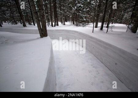 In this Monday, April 2, 2012 photo, a path cuts through deep snow at a former secret military camp during the fight against the Japanese and the site of what North Koreans say is the home of the late North Korean leader Kim Il Sung and the birthplace of his son and late leader Kim Jong Il at the foot of Mount Paektu, North Korea. (AP Photo/David Guttenfelder)