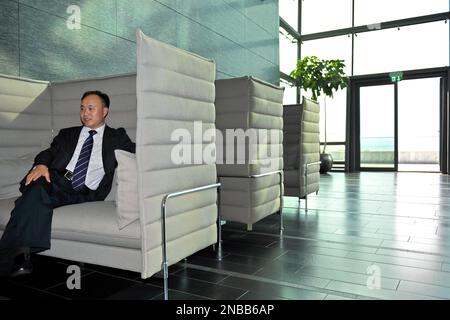 Zhengrong Shi, Founder and CEO of Suntech Power Co. Ltd., answers questions during an interview with the Associated Press at the WEF headquarters in Geneva, Switzerland, Thursday, Aug. 25. 2011. Shi Zhengrong, the CEO of Suntech Power Holdings Co., Ltd., said the G-20 advisory panel expects to issue a set of recommendations about five weeks from now on how world leaders can shift to solar, wind and other alternative energy sources - even in dire financial times. ( AP Photo/Keystone/Martial Trezzini) GERMANY OUT - AUSTRIA OUT