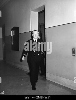 Lt. Adam Rother, 41-year-old Coast Guardsman, walks down the corridor of the Richmond County courthouse in the Staten Island borough of New York City, March 6, 1944, where his trial began on charges that he slew Rita Costello of Staten Island, his 28-year-old sweetheart. Rother said his service revolver went off accidentally during a scuffle in a cab. His wife, Harriet, will testify in his defense. (AP Photo/Matty Zimmerman)