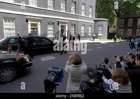 US President Barack Obama, center, waves to the media as he leaves 10 Downing Street in London, Wednesday, May 25, 2011. (AP Photo/Sang Tan)