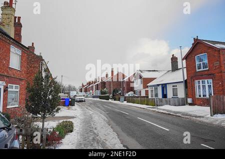 Vista di Wyberton West Road in condizioni climatiche fredde. Foto Stock