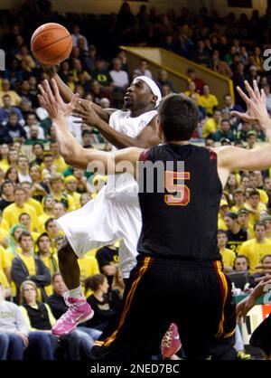 Southern California's Nikola Vucevic, (5), of Montenegro, is guarded by  Oregon State's Roeland Schaftenaar, of the Netherlands during the first  half of their NCAA college basketball game Thursday, Jan. 28, 2010, in