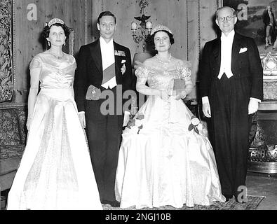 Her Majesty Queen Elizabeth, second from right, and His Majesty King George VI, second from left, are guests of U.S. Ambassador to Great Britain Joseph P. Kennedy and his wife, Rose Elizabeth Fitzgerald Kennedy, on May 4, 1939. They are attending a dinner at the American Embassy in London, England, two days before the Queen and King are to sail for Canada and the United States. (AP Photo)