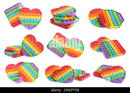 Set con i giocattoli fidget popolare Pop esso su sfondo bianco Foto Stock