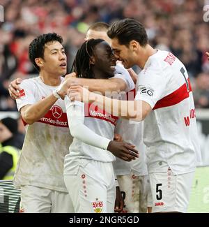 Stoccarda, Germania. 18th Feb, 2023. Tanguy Coulibaly (C) di Stoccarda festeggia con i suoi compagni di squadra dopo aver segnato durante la partita di calcio tedesca della prima divisione Bundesliga tra VfB Stuttgart e il FC Cologne a Stoccarda, Germania, 18 febbraio 2023. Credit: Philippe Ruiz/Xinhua/Alamy Live News Foto Stock