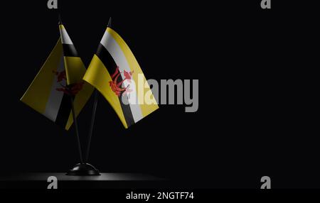 Piccole bandiere nazionali del Brunei su sfondo nero. Foto Stock