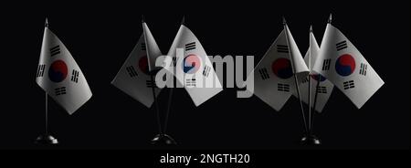 Piccole bandiere nazionali della Corea del Sud su un nero sfondo Foto Stock