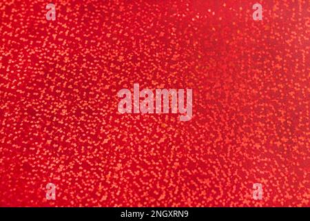 Tessuto olografico rosso arcobaleno, sfondo con motivo glitter, Foto Stock