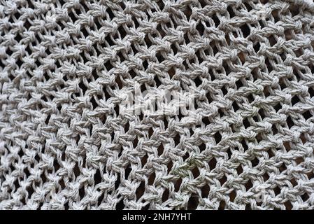 Vari nodi di tecnica macrameè realizzati con fili bianchi Foto Stock