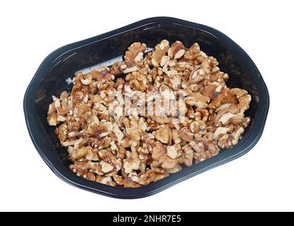 Noci spellate in una scatola di plastica. Isolato su bianco Foto Stock