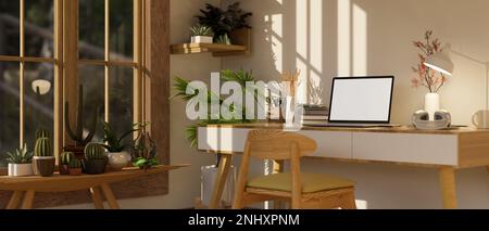 Vista laterale dell'interno della camera da lavoro accogliente e minimale con mockup per computer portatile e decor su tavolo in legno, sedia in legno minimale, piante da casa su tavolo in legno Foto Stock