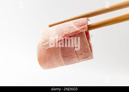​​pork a fette sottili. Panino di maiale surgelato. Cultura gastronomica coreana Foto Stock
