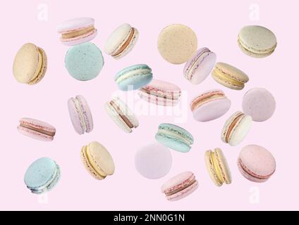 Dolci e deliziosi macaron che volano su sfondo rosa Foto Stock