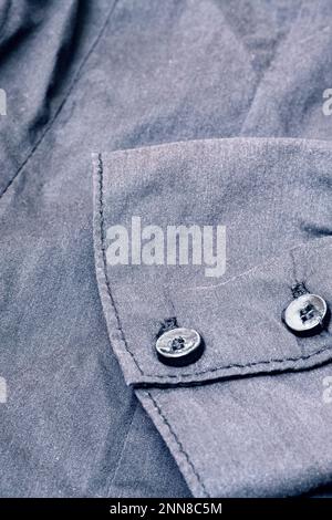 Bottoni su una maglia nera primo piano, foto macro Foto Stock