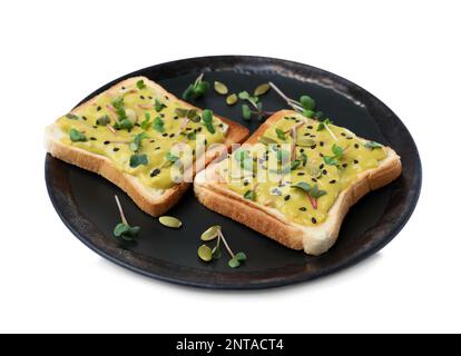 Deliziosi panini con guacamole, microgreens e semi su sfondo bianco Foto Stock