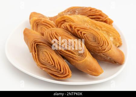 Il Thumb indiano di Madatha Khaja anche denominato Gottam Kaja, Badusha, Chirote, Kakinada Kaaja è tradizionale Pasticceria dolce a strati famosa in Andhra, Bengala Foto Stock