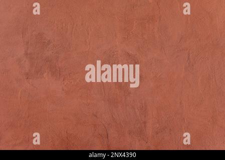 Struttura di intonaco decorativo rosa o calcestruzzo. Parete in stucco di colore rosa verniciato con spazio copia Foto Stock