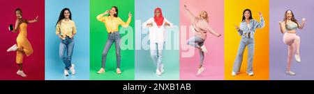 Gruppo di diverse femmine multietniche che hanno divertimento su sfondi colorati Foto Stock