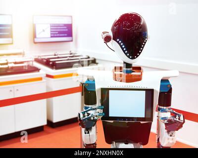 Robot Android a lavorare alla mostra Foto Stock