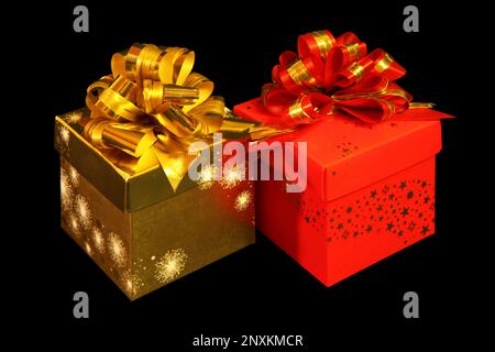 Primo piano su due confezioni regalo con isolamento su sfondo nero. Foto Stock