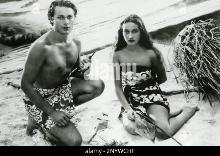 Attori americani Jon Hall e Dorothy Lamour nel film The Hurricane, USA 1937 Foto Stock