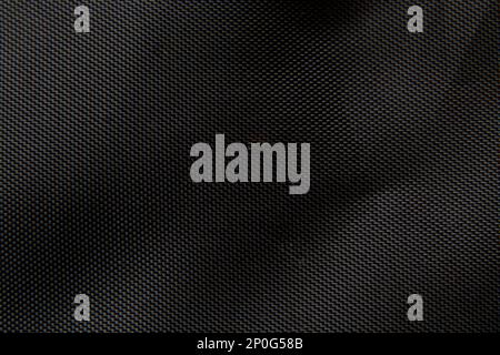 tessuto faux con pieghe nere come sfondo Foto Stock